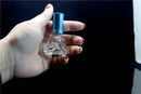 Botella de perfume transparente rellenable